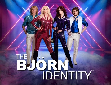 Vibrant tribute band Björn Identity performing ABBA hits under dynamic stage lights.
