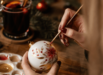 Cosy Christmas crafts with mulled wine by candlelight at luxury hotel